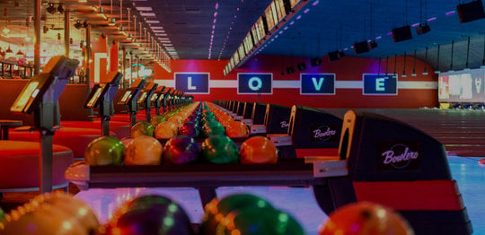 Ball returns with bowling balls and 'LOVE' written out on the wall