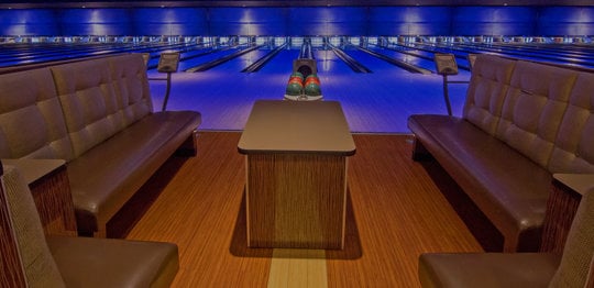 Front view of bowling lanes with plush couches