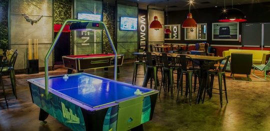 Air hockey, pool table, and dining area
