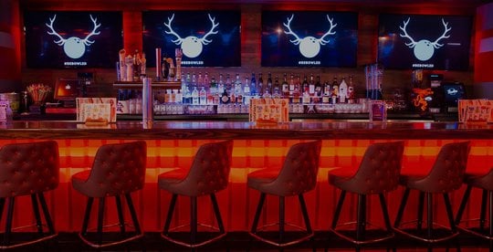 view of bar lit red