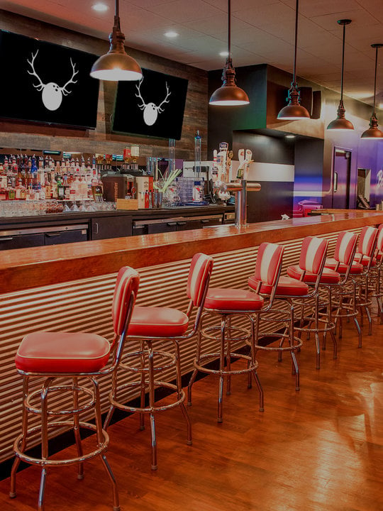 Retro bar area with red stools