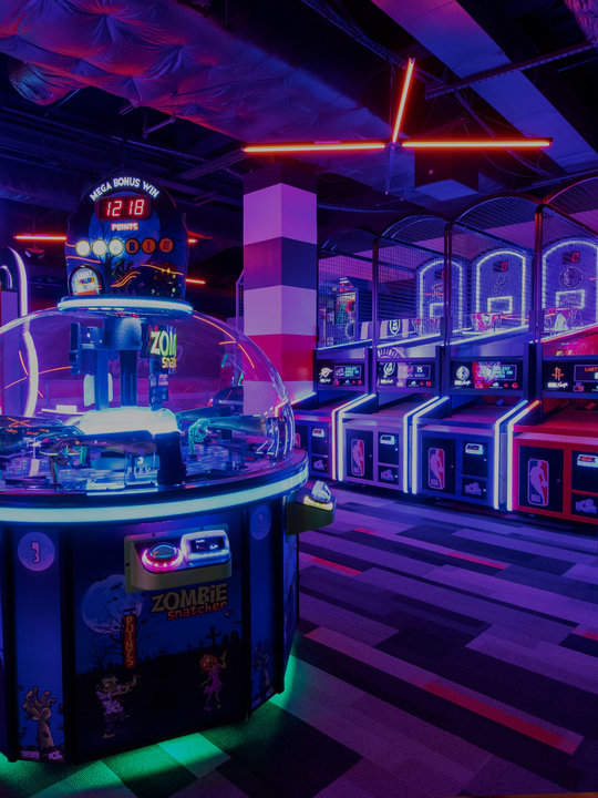view of an arcade, lit with neon