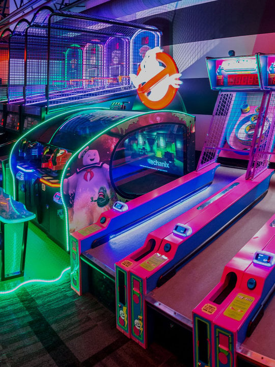 Arcade games with neon lighting