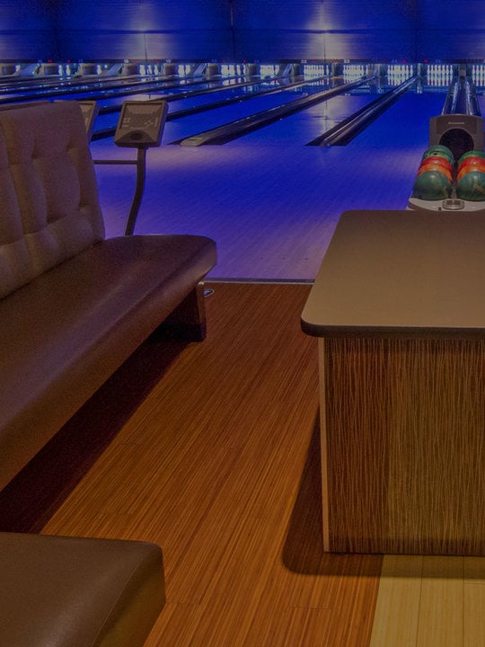 Front view of bowling lanes with plush couches