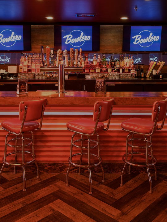 Retro bar area with red stools