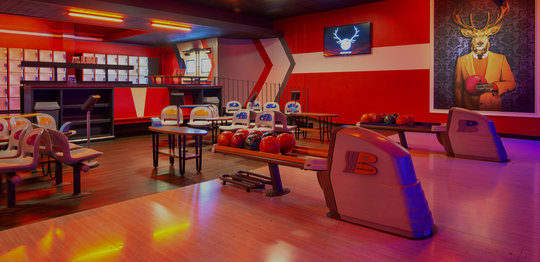 Lanes, seating, and lockers at Bowlero West Covina