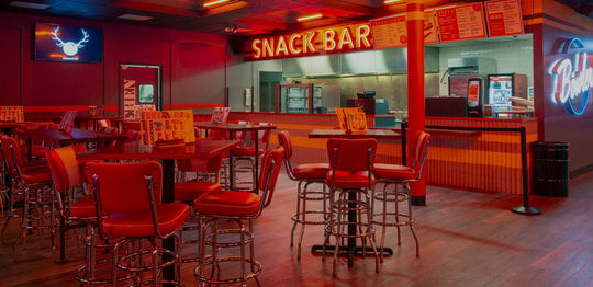 Snack bar and dining area at Bowlero West Covina
