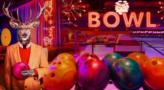 Collage of images of an anthropomorphic illustration of an elk holding a bowling ball wearing a suit, neon signs that say BOWL, and bowling alleys