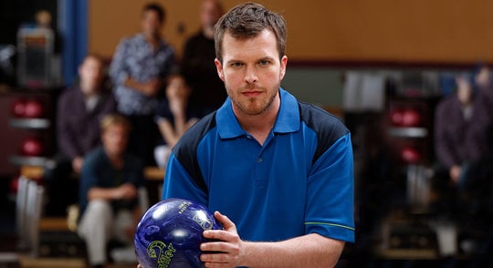 Male league bowler holding a bowling ball