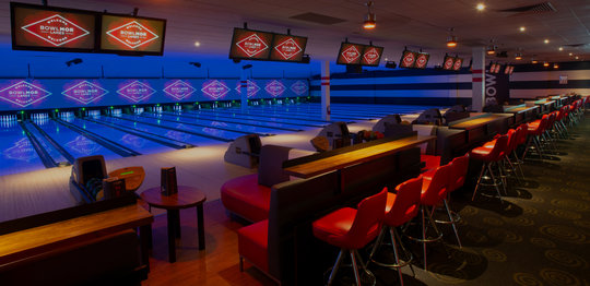 Lanes with bar stools in back
