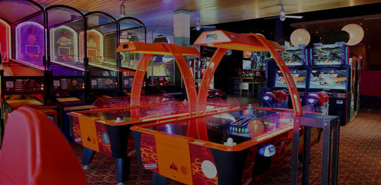 Air hockey tables and arcade games