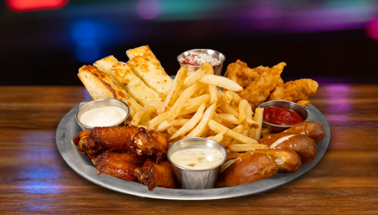 Sampler Plate with wings, french fries, pretzel bites, and chicken strips