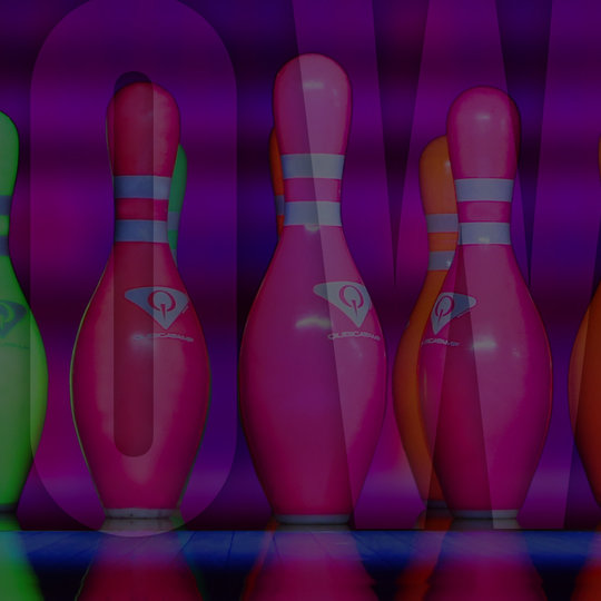 neon bowling pins in a row