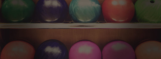 two rows of colorful bowling balls