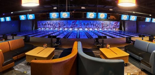 Tables and lanes at a bowling center