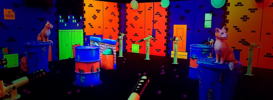 brightly colored obstacle course with balladium launchers on either side